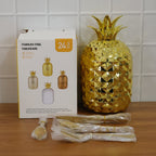 Complete cutlery set displayed with decorative pineapple holder for storage