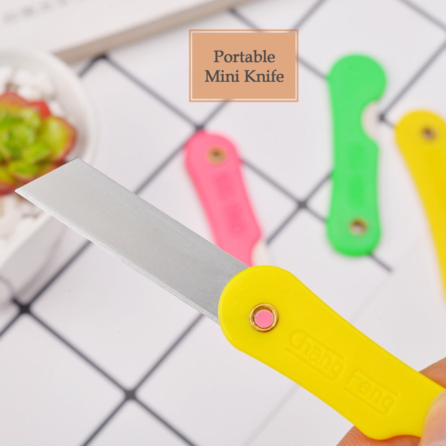 Arrangement of the 12-pack multicolour mini paper cutter knives, highlighting variety.