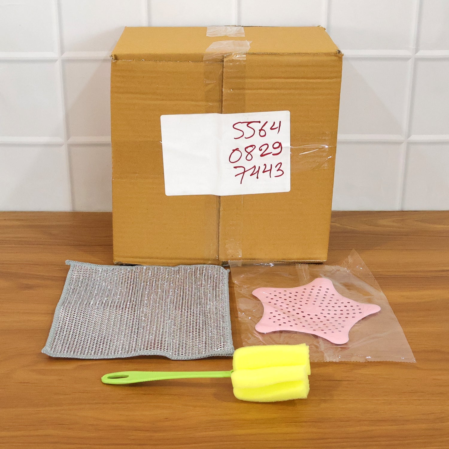 Sink strainer and cleaning brush used for effective kitchen maintenance