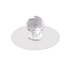 Crystal cabinet knob elegantly installed on a light wooden drawer for a modern look.