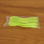Collection of white plastic spoons arranged neatly, ready for use at any meal.