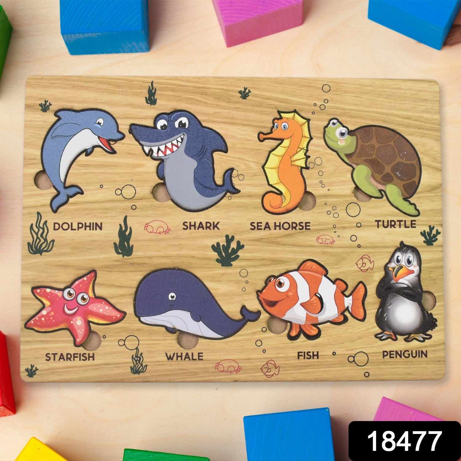 Child's hands interacting with a colourful wooden ocean animal puzzle.