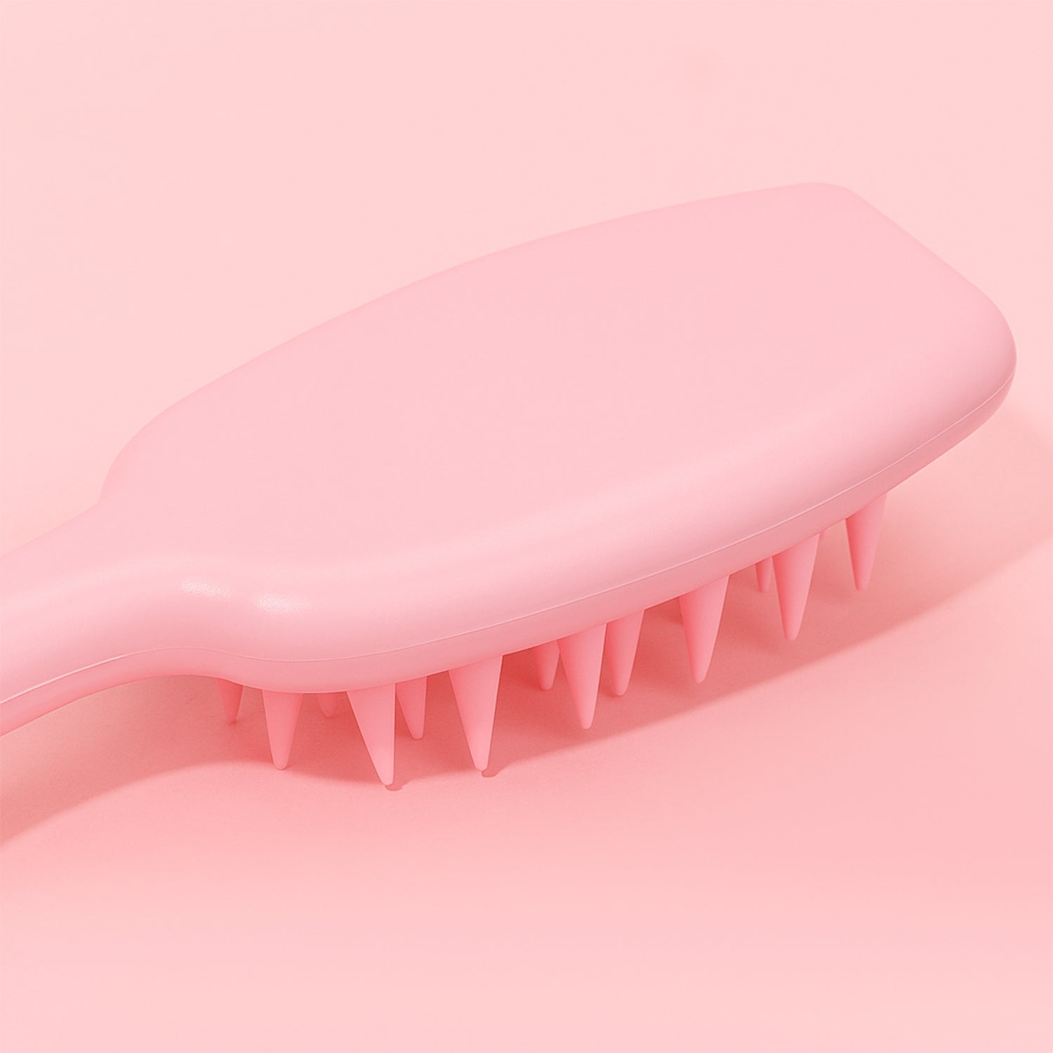 Silicone scalp scrubber shampoo brush showing gentle bristles