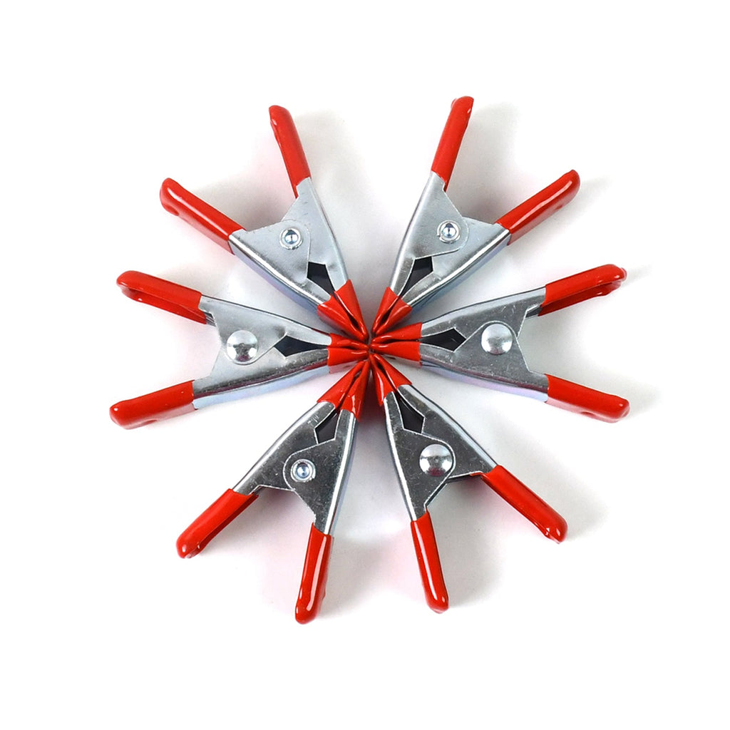 Detail of the 2-inch metal spring clamp's rotating jaw pads providing a tight, secure grip.