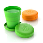 A vibrant folding travel cup with a lid, perfect for kids and camping trips.