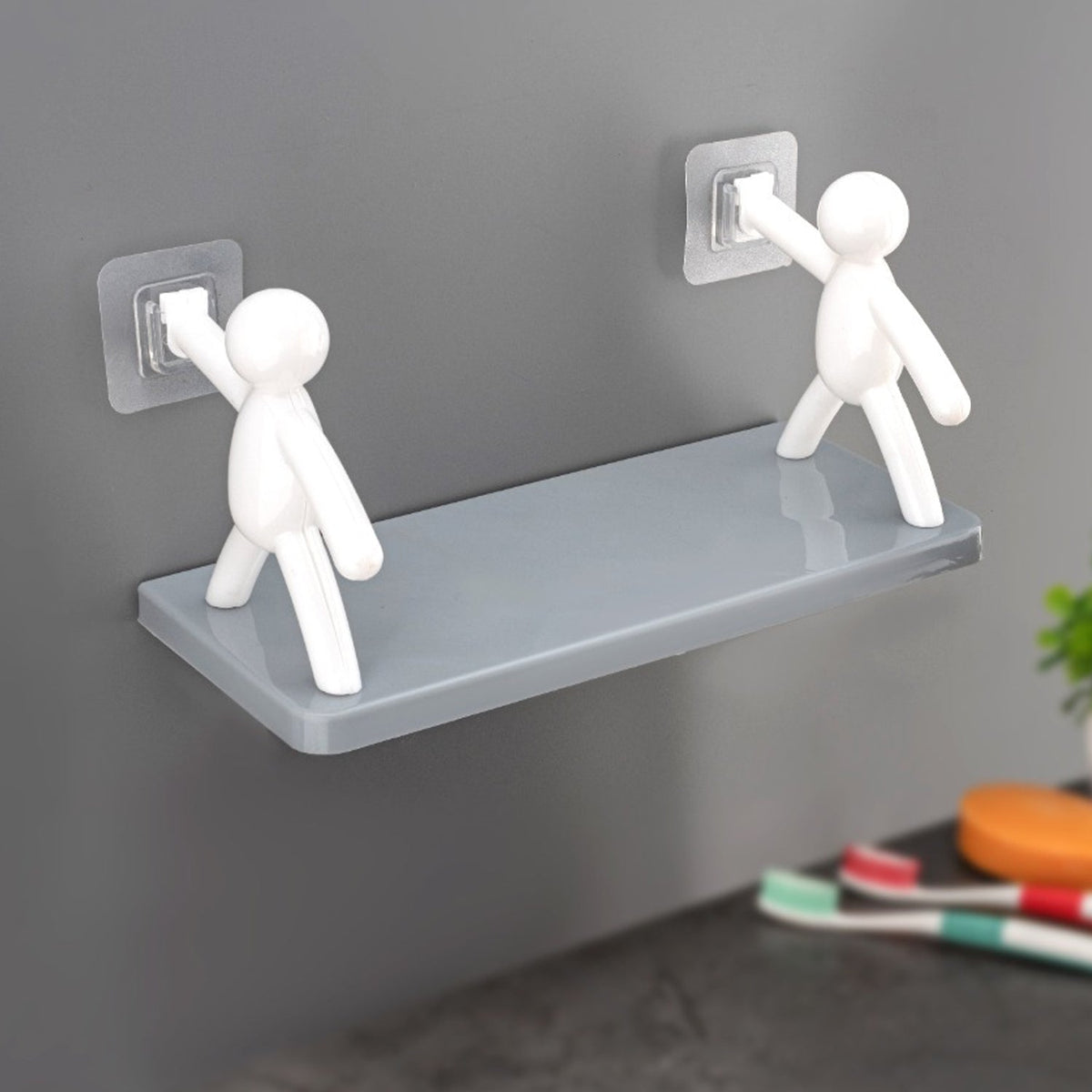 An elegant floating wall shelf in a modern living room, displaying decorative items.