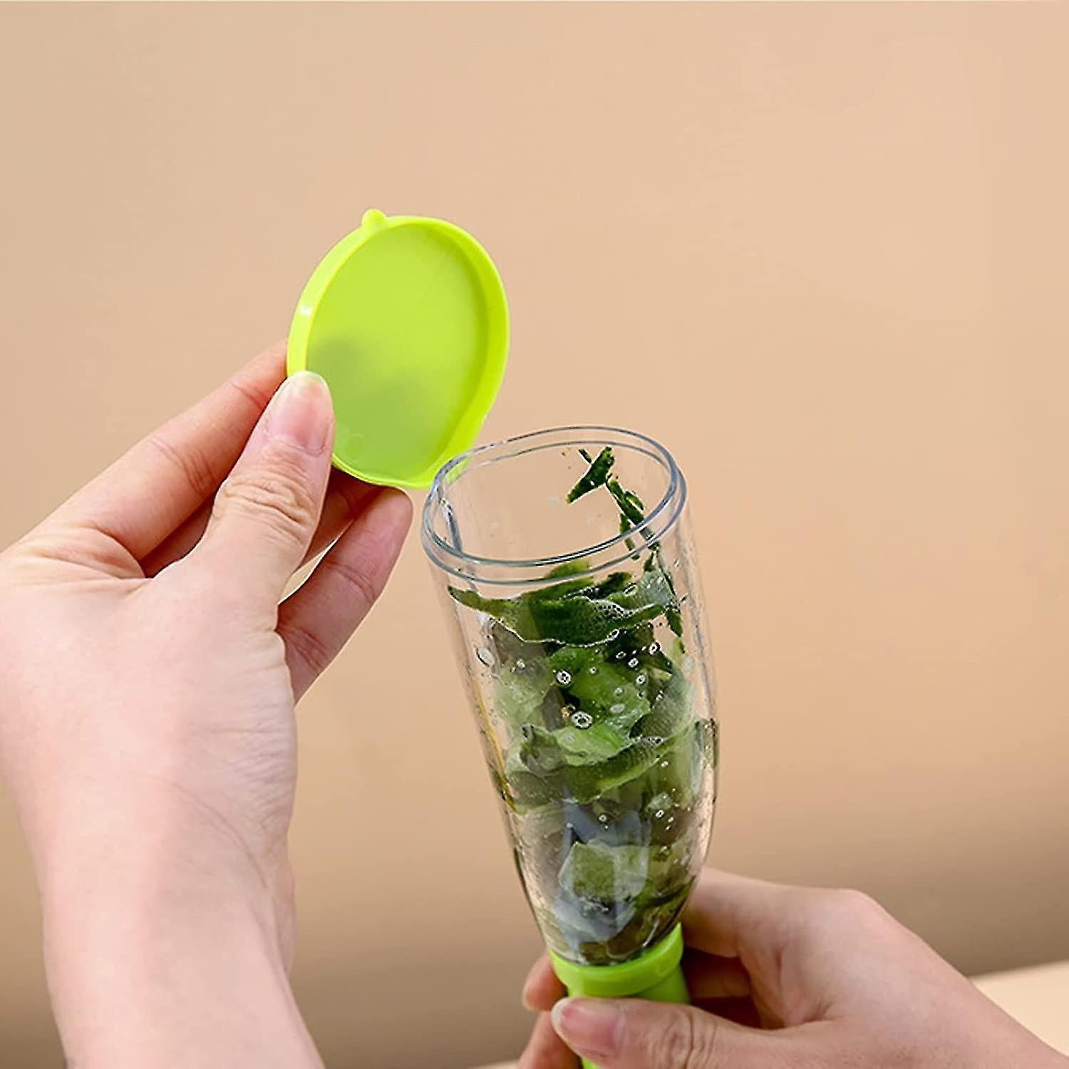 Innovative kitchen peeling tool with a clear view of its collection chamber.