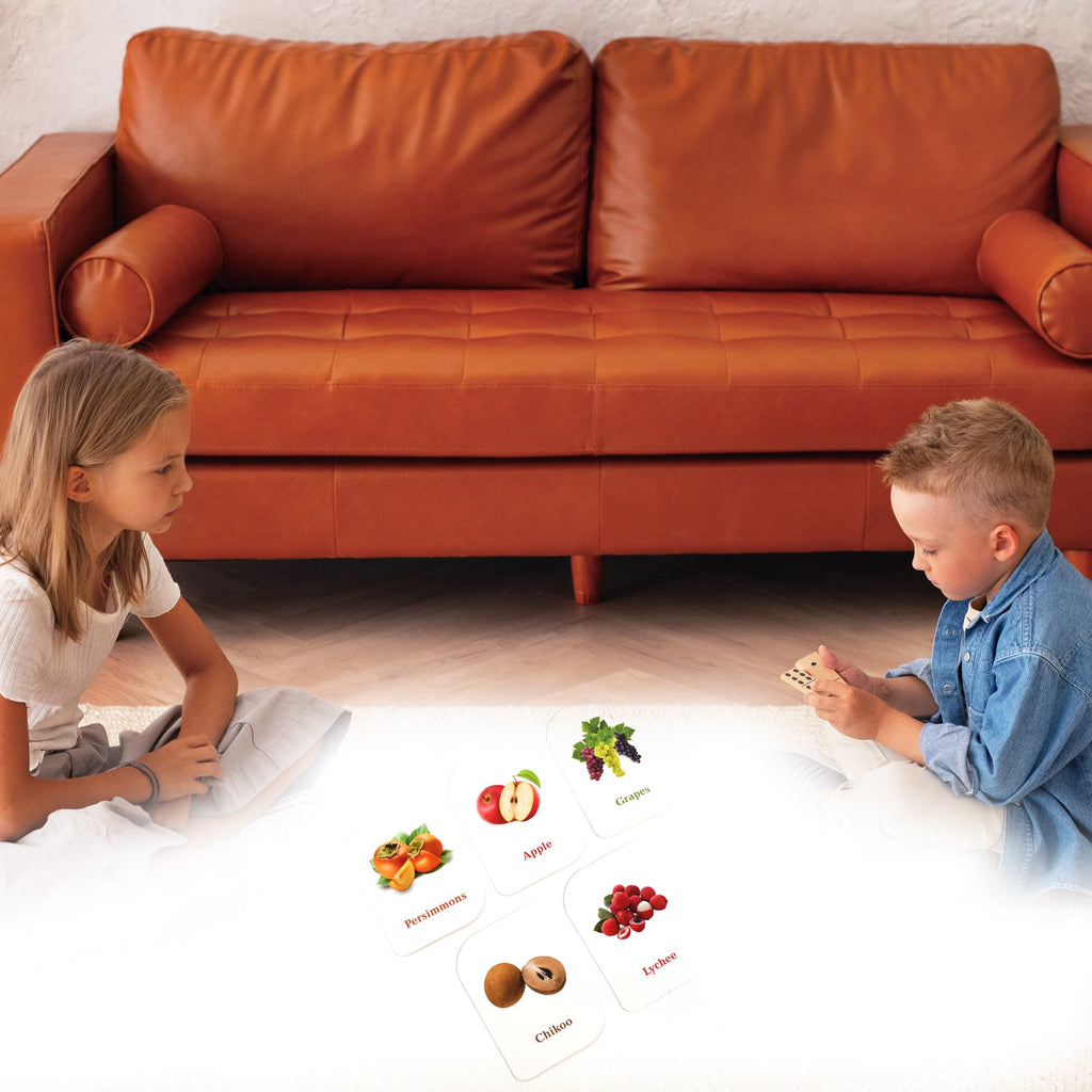 Close-up of laminated fruit learning card emphasizing vivid fruit image