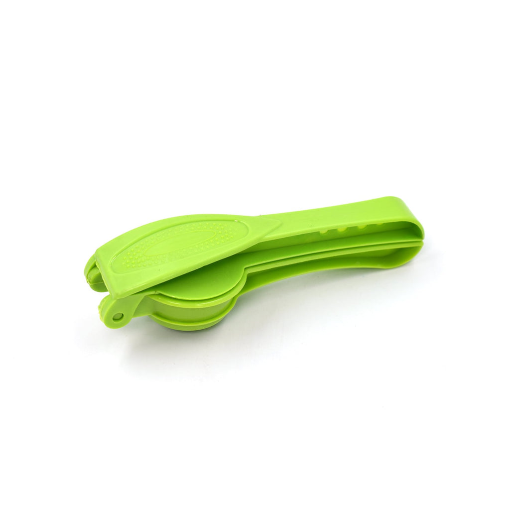 The compact plastic lemon squeezer and bottle opener placed on a clean kitchen surface.