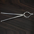Ganesh 8mm stainless steel tongs, ideal for holding hot utensils, shown from a side angle.