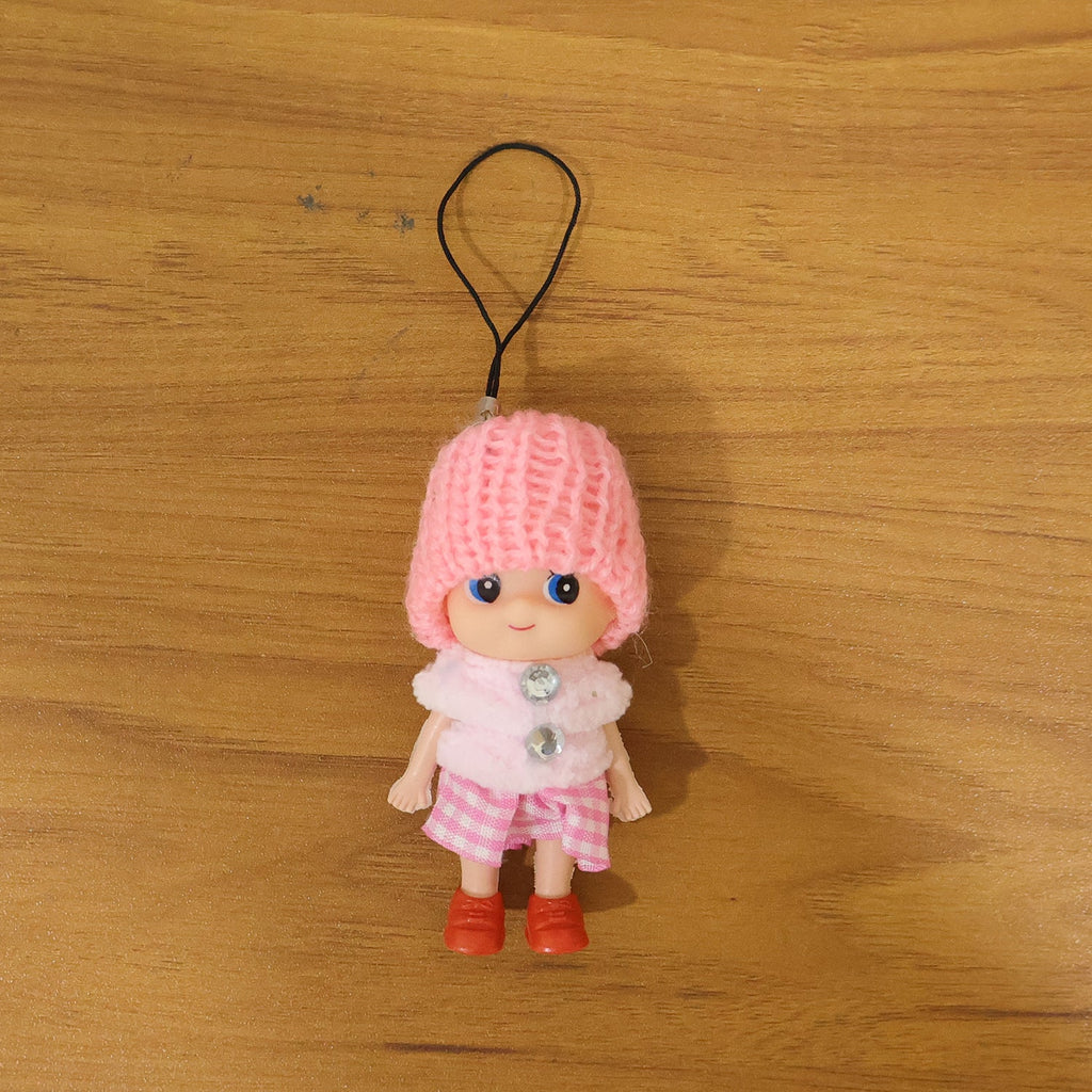 Vibrant outfit of mini doll keychain in colorful setting