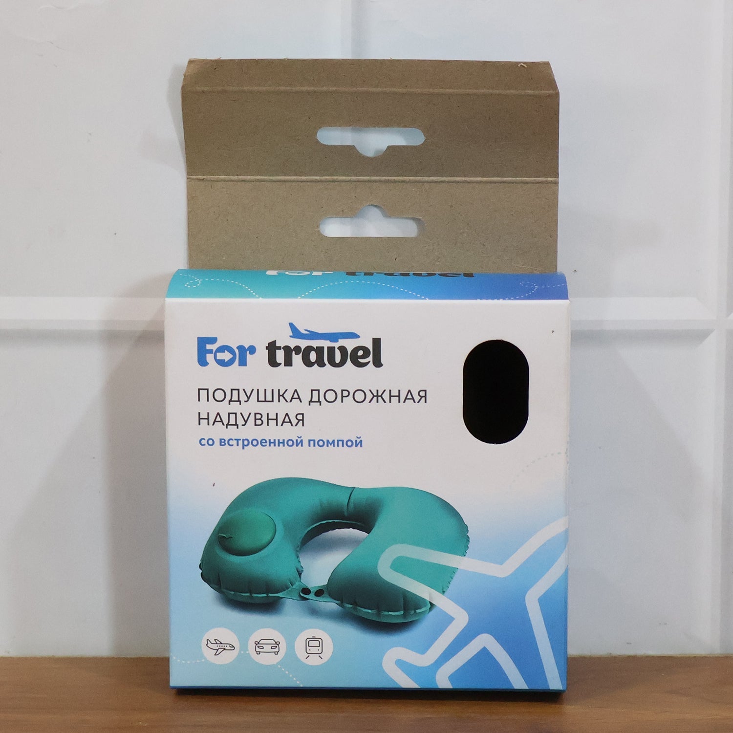 Inflatable travel neck pillow packaged with user instructions