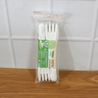 Hand holding compostable bagasse fork demonstrating convenience and durability