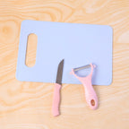 Close-up of peeler and paring knife in multipurpose fruit cutting set