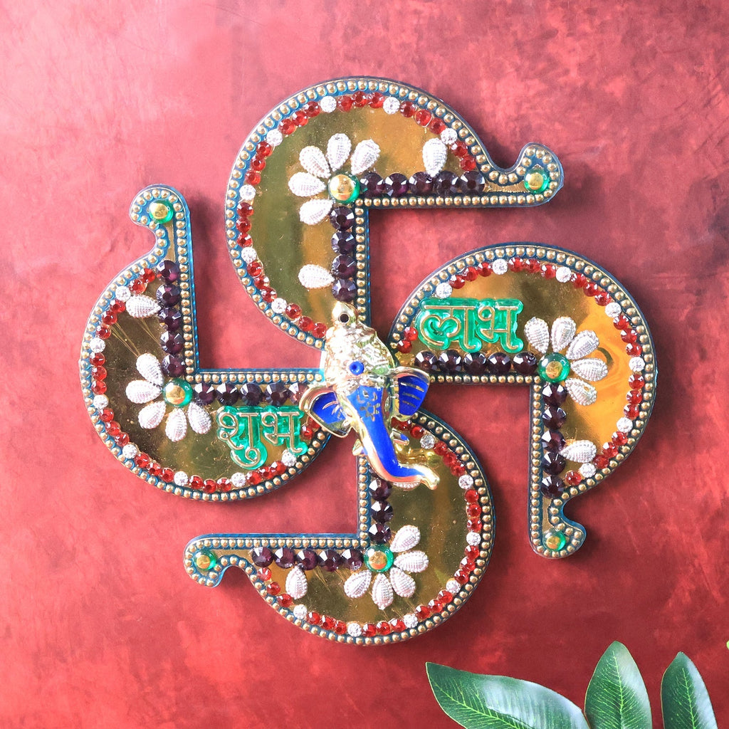 Golden Shubh Labh Swastik wall hanging decorated with floral motifs and Ganesh idol