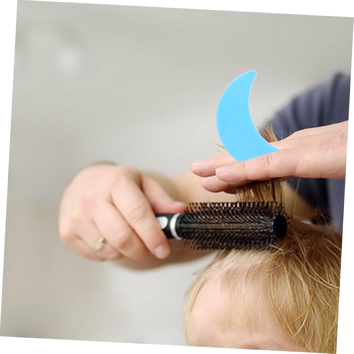 Close-up of haircut stencil template showing plastic construction