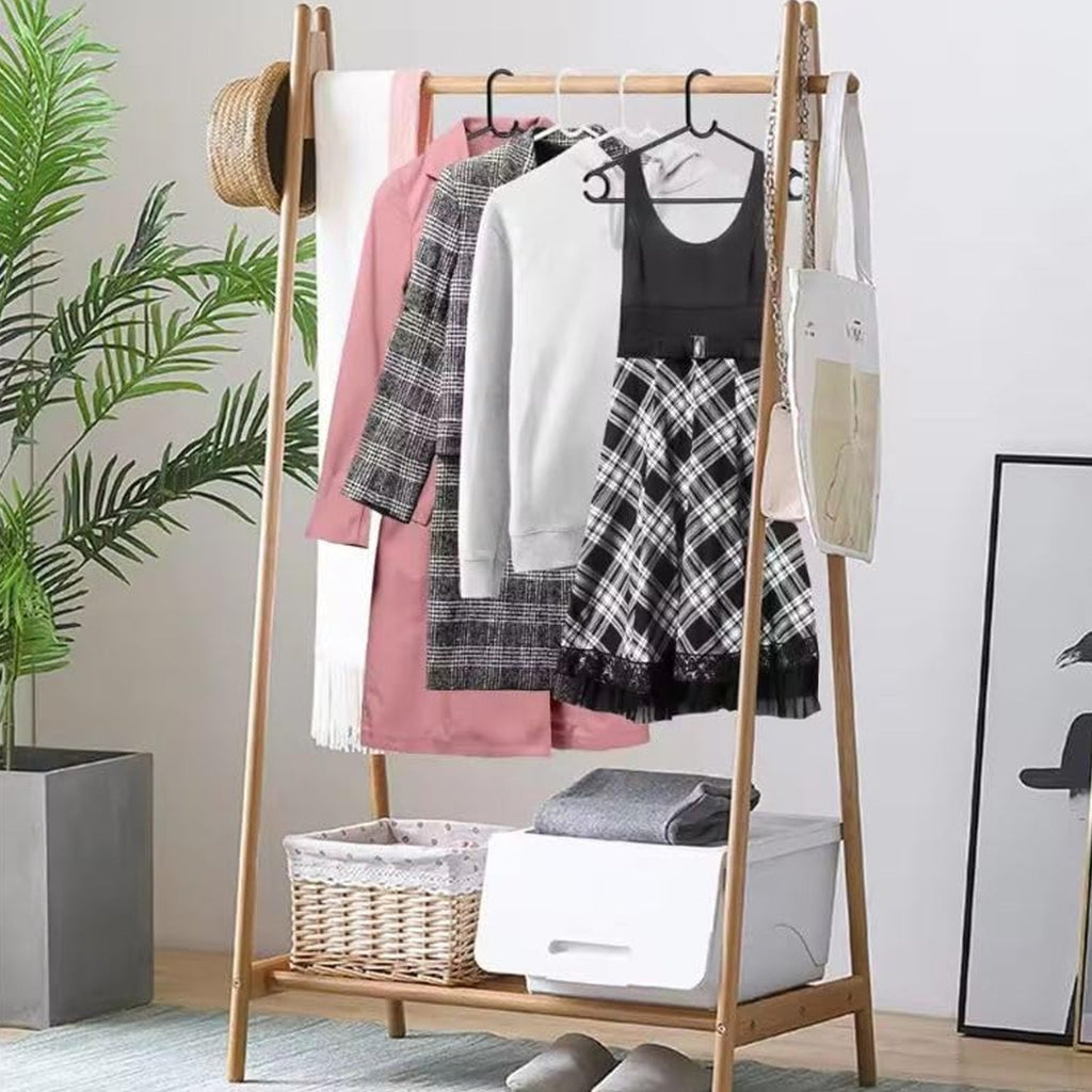 White plastic hanger holding a shirt to keep it wrinkle-free