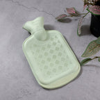 Green rubber hot water bag designed for comfortable pain and cramp relief