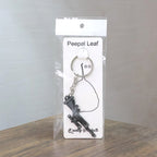 Compact metal rifle gun keychain attached to a keyring for everyday use