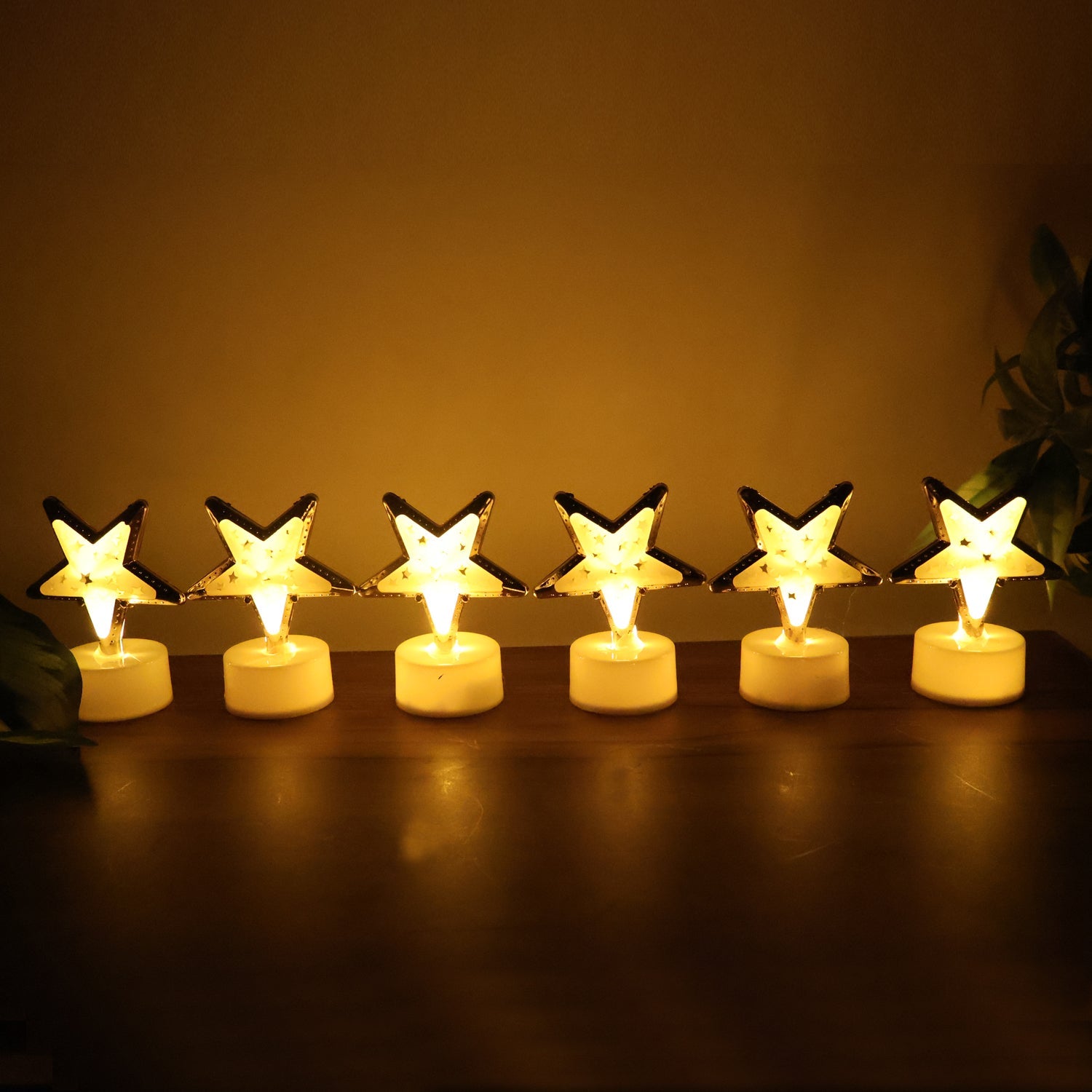 Battery operated star shaped LED candle with easy on/off switch at base