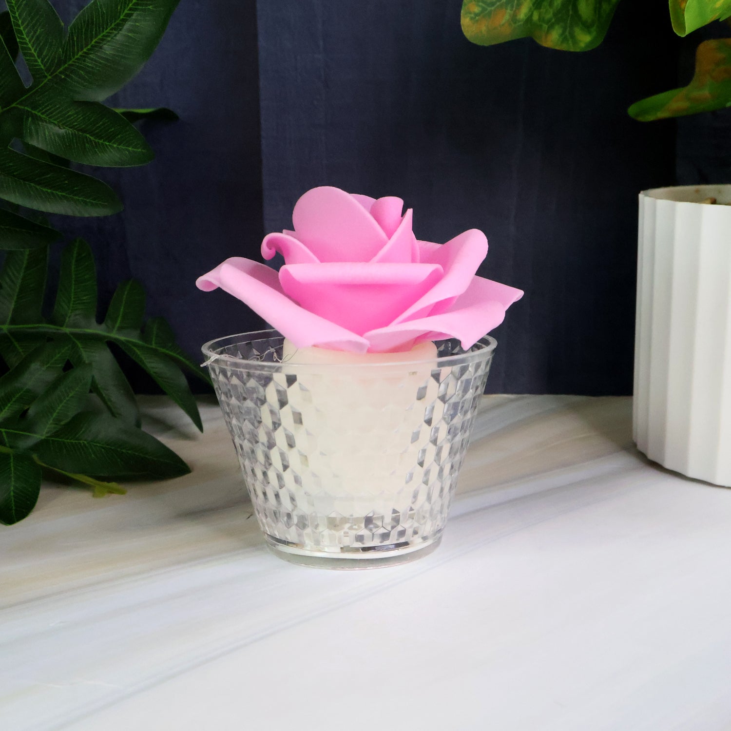 Multiple rose shaped flameless LED candles arranged for wedding decoration