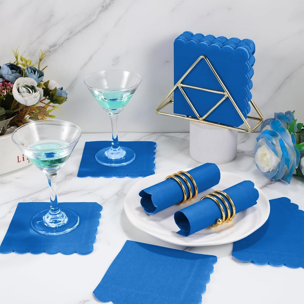 Scalloped paper napkin placed neatly on a formal table setting