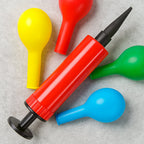 Handheld balloon pump with ergonomic handle for comfortable grip