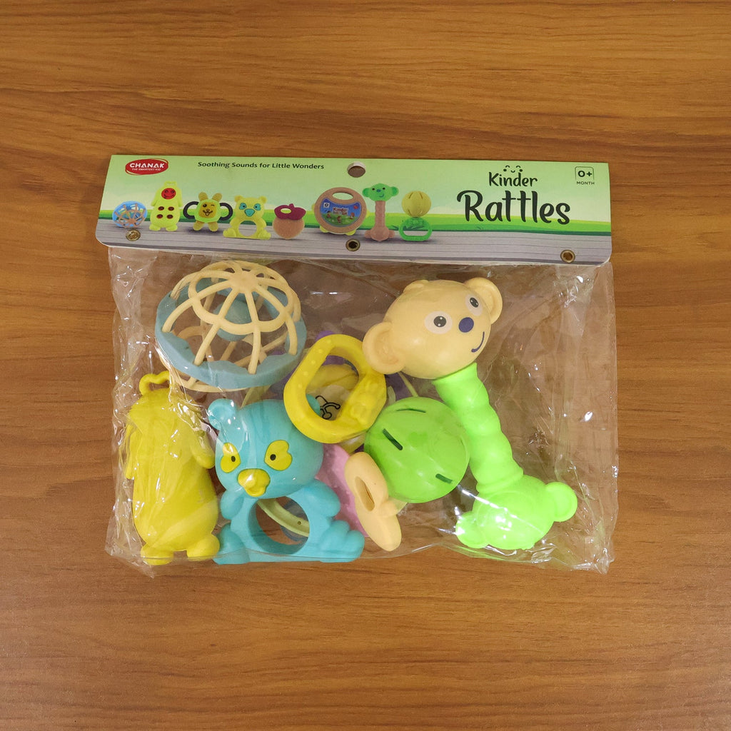 Overhead view of a neatly arranged collection of engaging baby rattles.