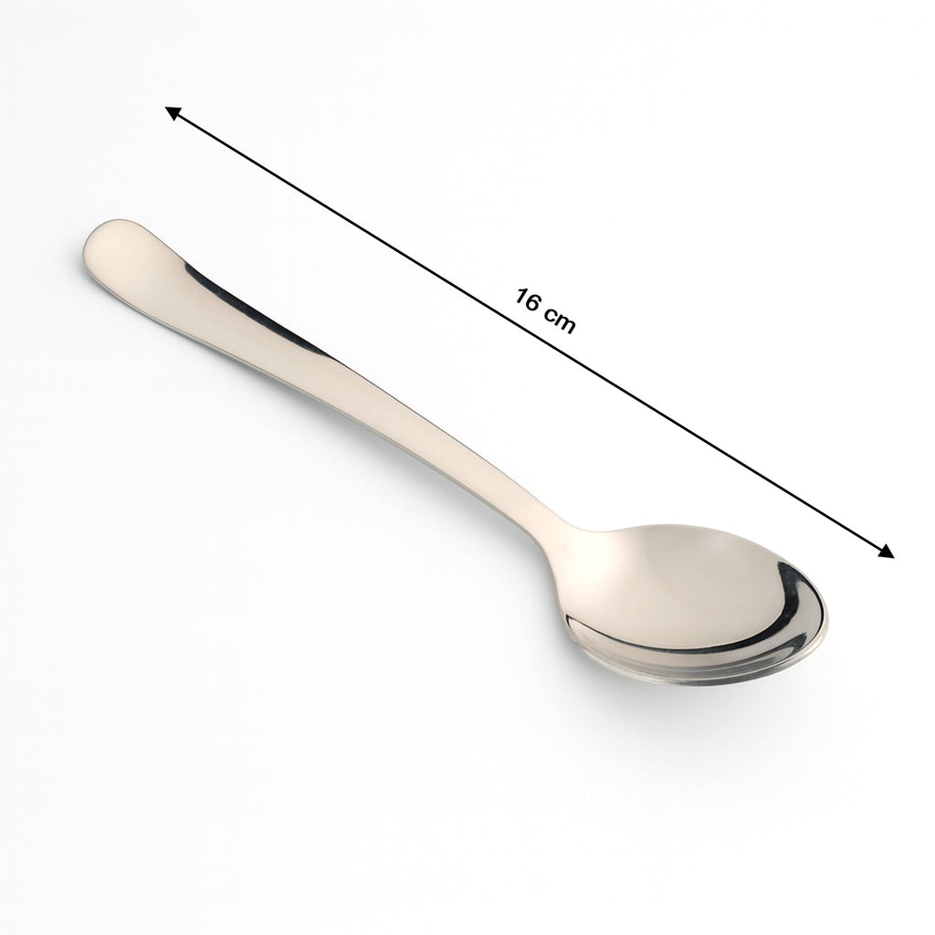 Stainless Steel Dining Spoon resting on a plate, ready for a meal, showcasing its balance.