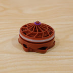 Plastic spinning top with spark effects