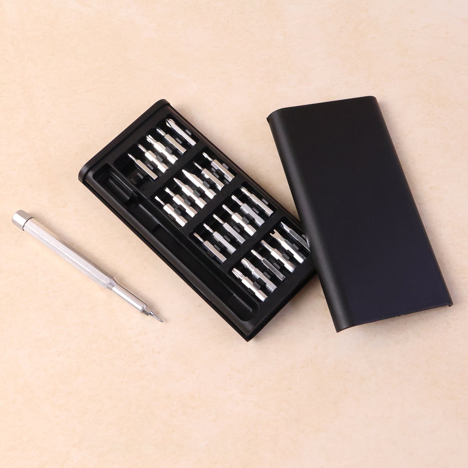 Complete 24-in-1 precision screwdriver tool set for electronics repair in its aluminium case.