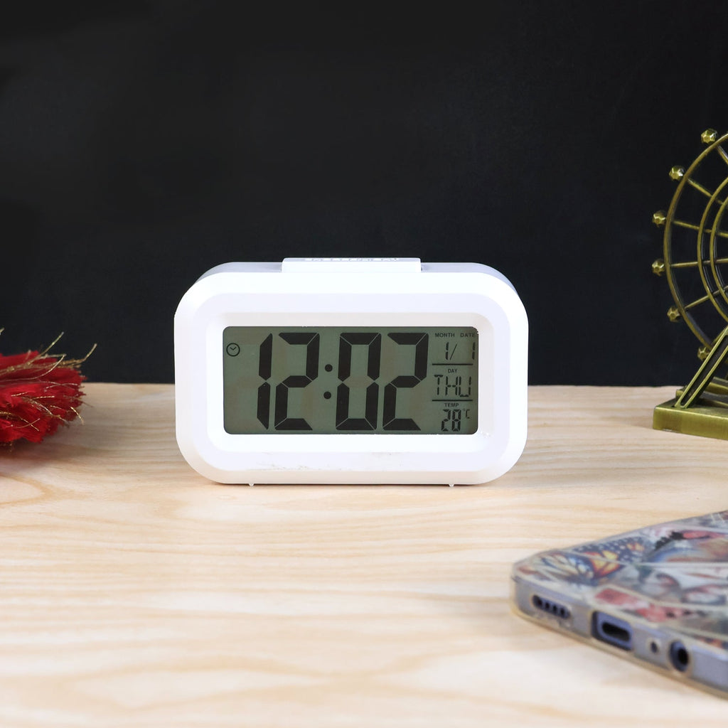 Side view of compact digital alarm clock with temperature sensor