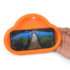 Orange waterproof mobile stand securely holding a smartphone, mounted on a bathroom wall.