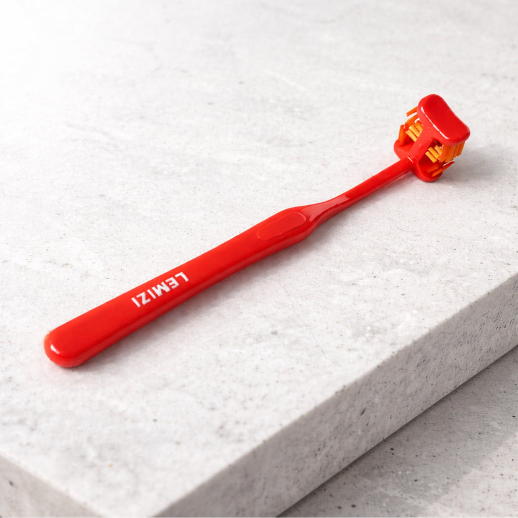 Top-down view of the Six-Sided Toothbrush head, illustrating its multi-angle design.