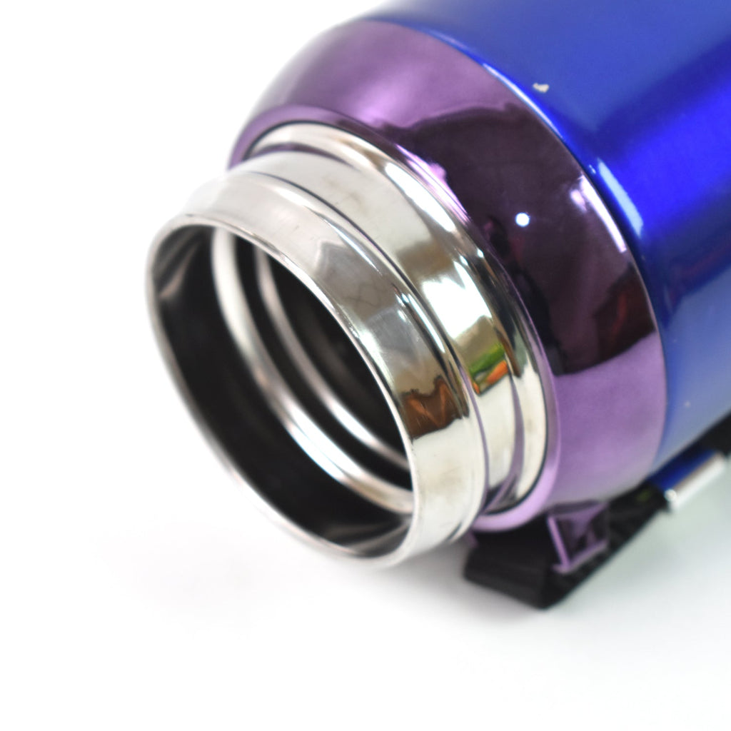 Assorted colored stainless steel bottles on wooden surface