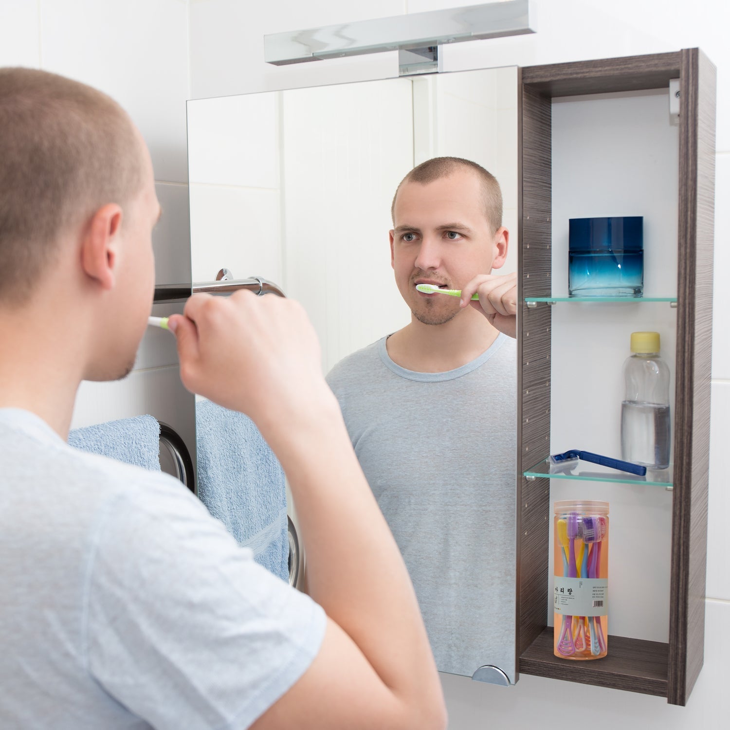 Side view of a compact, portable toothbrush holder with a secure cover.