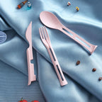 The 3-in-1 reusable spoon, fork, and knife set neatly folded into its compact travel form.