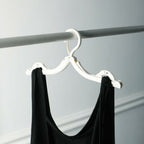 Compact foldable hangers suitable for a wide range of clothing, ideal for travel and home use.