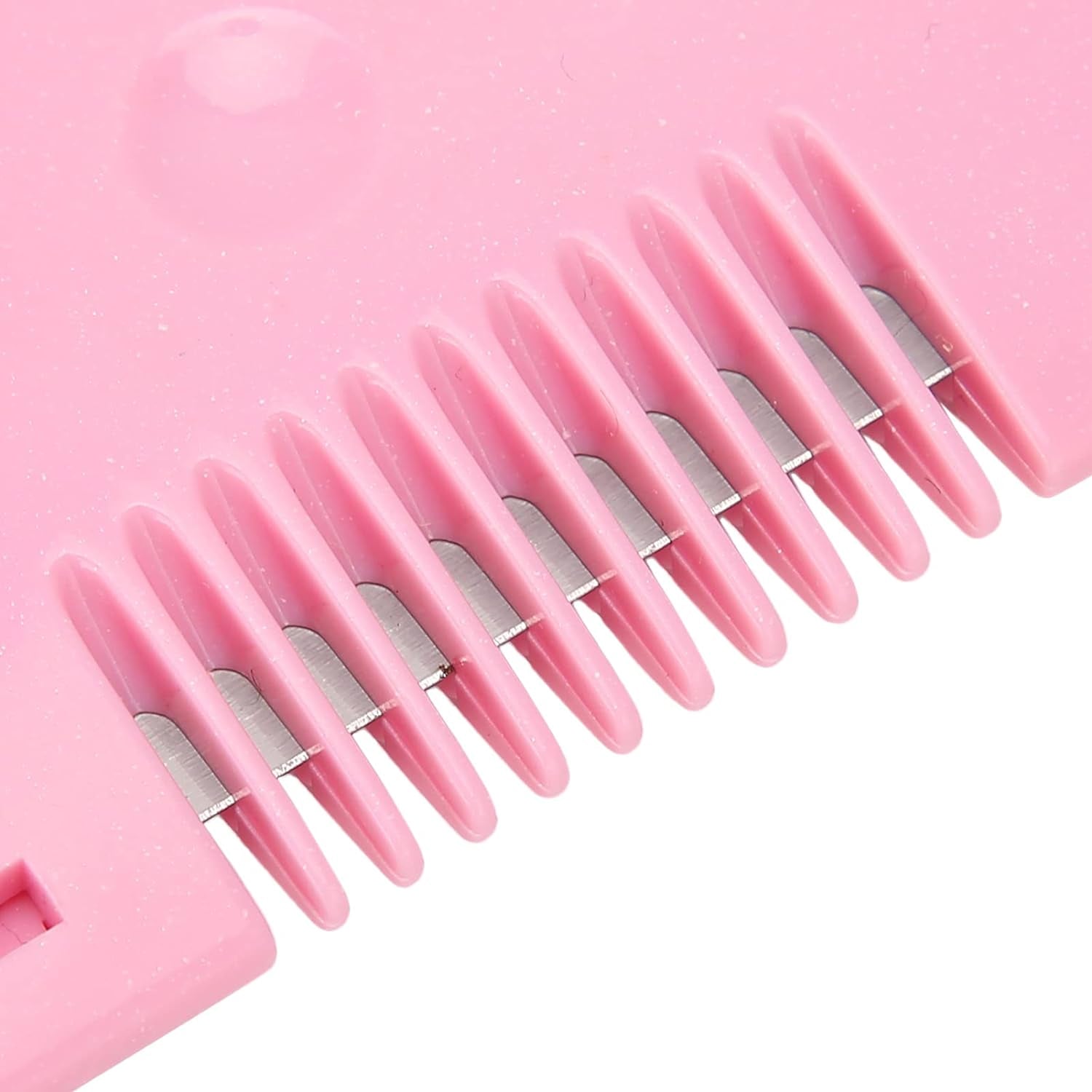 Heart-shaped baby hair scissors laid on a clean surface.