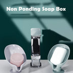 Elegant leaf-shaped plastic soap holder in white, designed for optimal drainage.