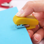 Assorted color mini staplers for school and office tasks