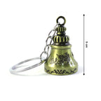 Metal temple bell keychain held in hand showcasing size and design
