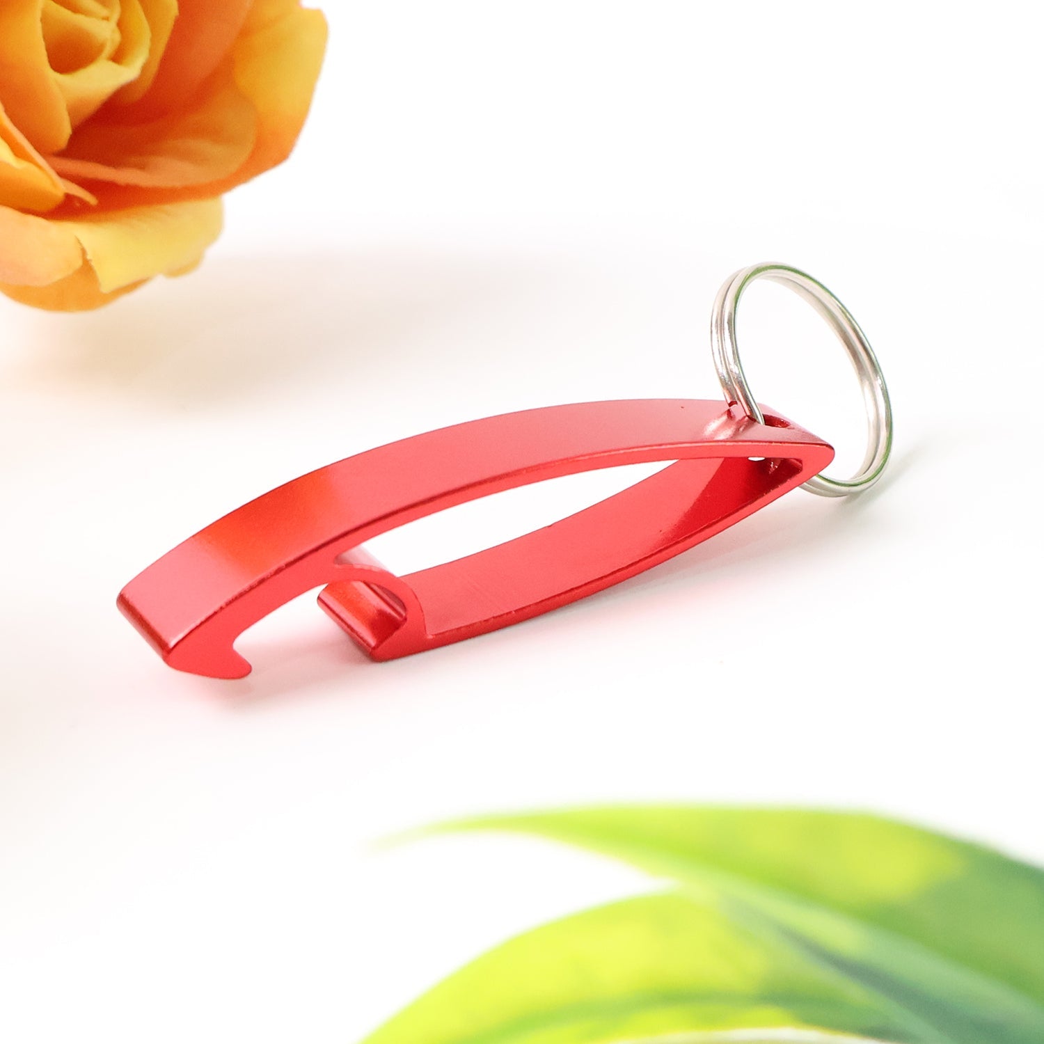 Red metal bottle opener keychain with ergonomic lever design