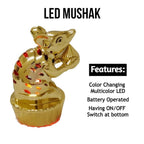 Golden LED Mooshak light placed among other Ganpati festival decorations.