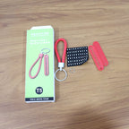 Keychain featuring vibrant red braided strap and unique numbered plate for identification