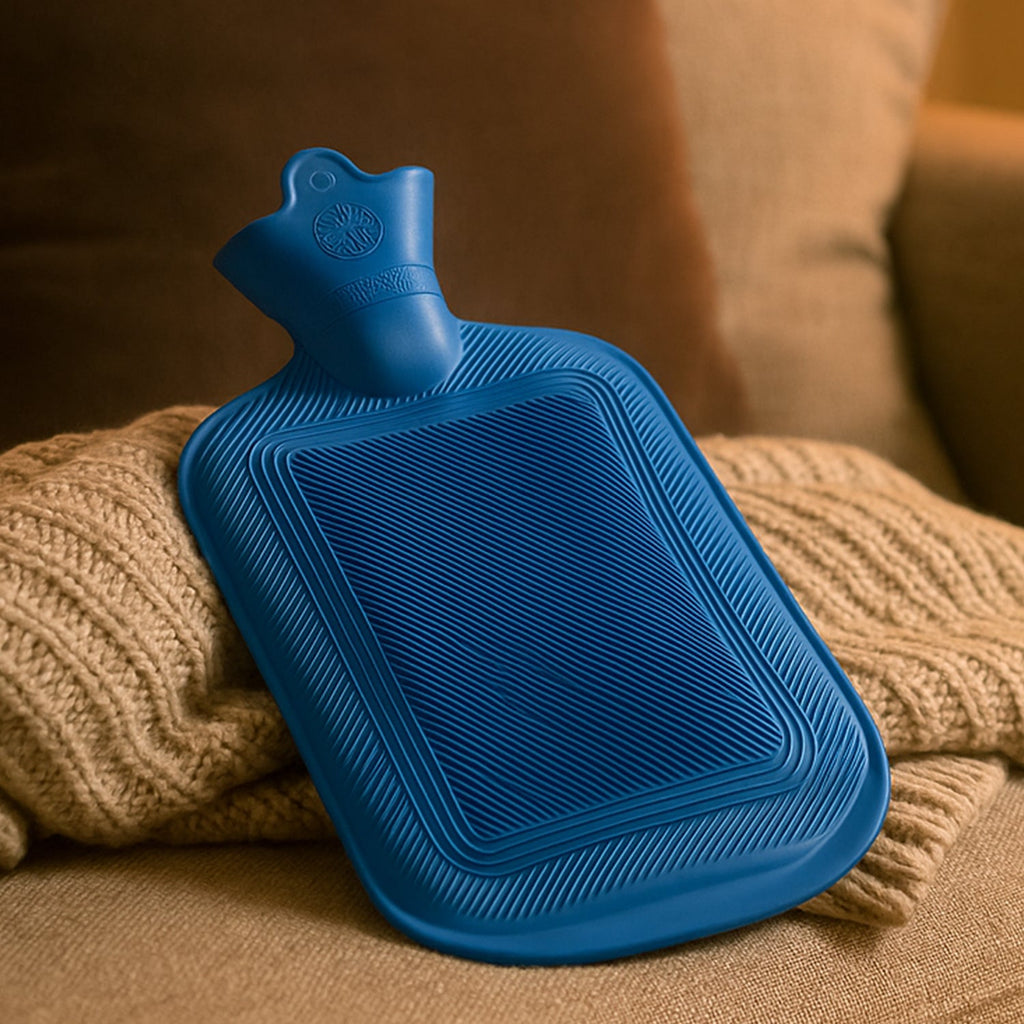 Front view of a vibrant red Rubber Hot Water Bag, ready for use.