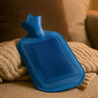 Front view of a vibrant red Rubber Hot Water Bag, ready for use.