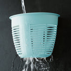 Collection of hanging plastic storage baskets in various colors, demonstrating versatility.
