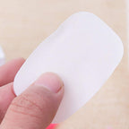 Compact mini box containing travel paper soap sheets for easy portability