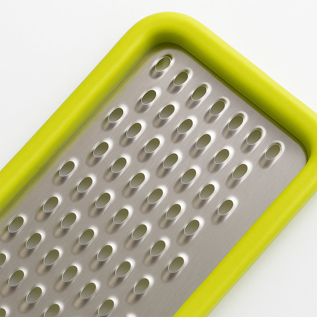A person holding the CookAura grater, demonstrating its size and ease of handling.
